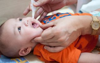 Oral vaccination of a baby